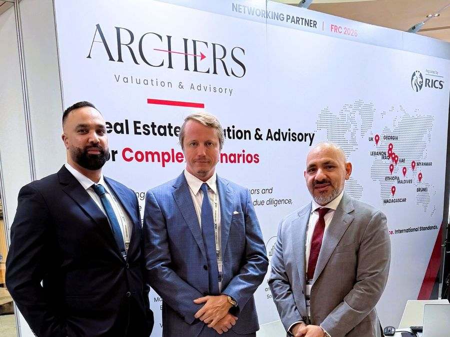 Rus Kolinko (centre) with two Archers colleagues at the Archers stand, FRC 2026