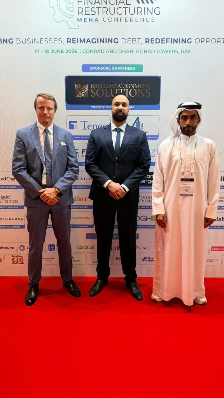 Rus Kolinko, an Archers colleague and a conference guest at the Financial Restructuring MENA Conference sponsors wall